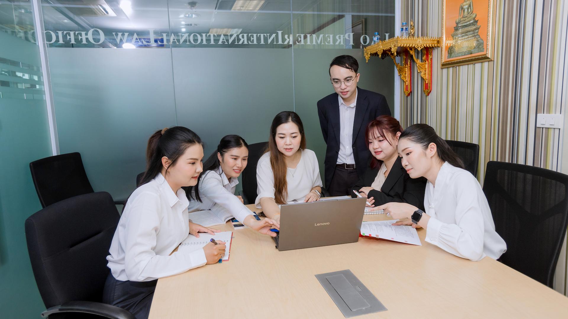 Photo of the Lao Premier team in a meeting